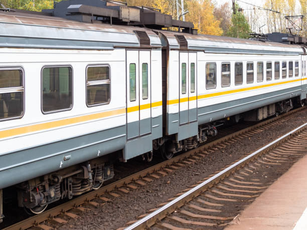 train cars on railway platform in Moscow region train cars on railway platform in Moscow region on autumn evening railroad track concrete railway sleeper thoroughfare stock pictures, royalty-free photos & images