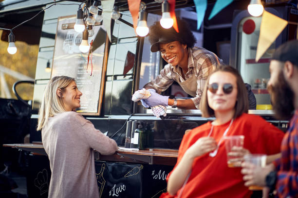 istock Food truck employee taking orders from customers 1278986558
