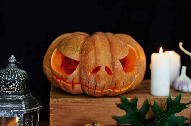 istock Carved Jack-o-lantern pumpkin at Halloween theme 1278987542