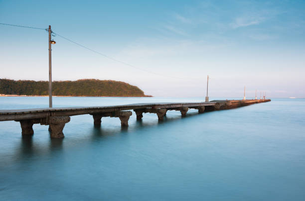 istock Small Wooden Pier on Beach in Japan 1278987712