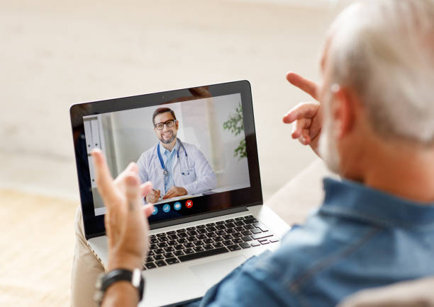 istock Senior man speaking with online doctor 1278990041