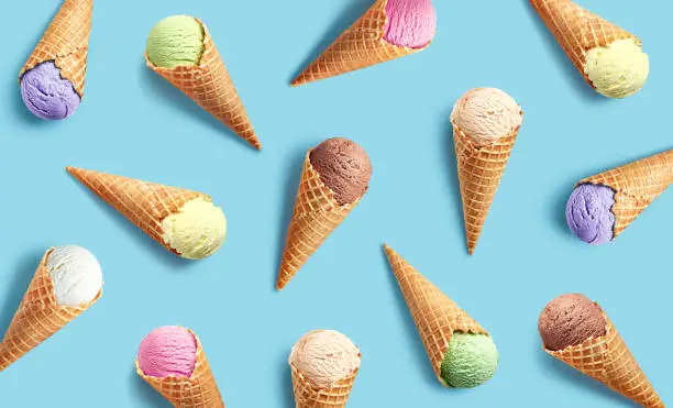 Colorful ice cream pattern on blue background, top view, flat lay