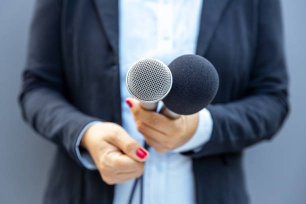 istock Television journalist holding microphone during media interview. Journalism concept. 1278990694