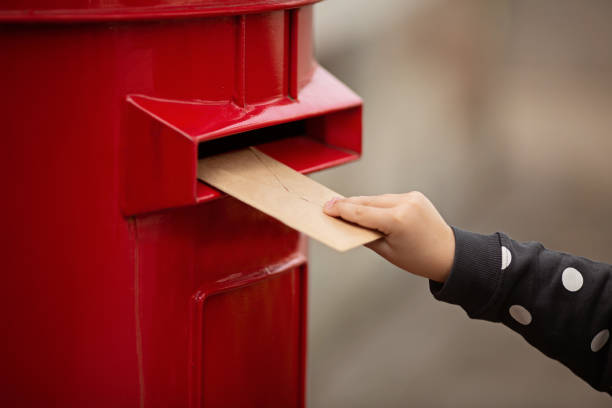 istock Hand holding envelope. Voting by Mail for absentee ballot or mail-in voting in the presidential election during coronavirus covid-19 pandemic 1278991650