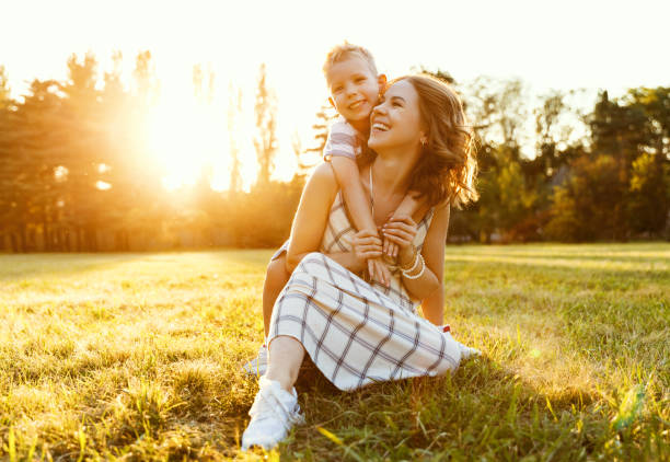 istock Happy family: mother and son hugging in nature in summer 1278993502