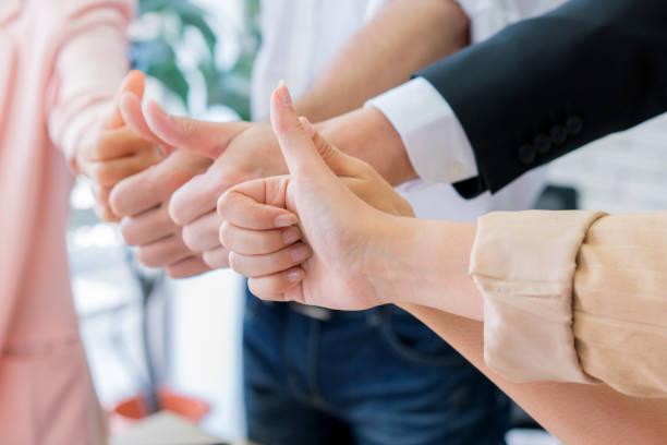 istock Successful business group with thumbs up in modern office 1278993538