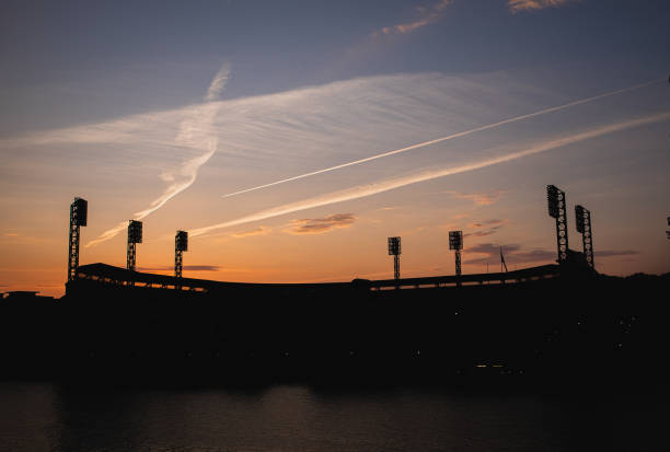 Sunset over MLB Baseball Staduim PNC Park with no fans due to COVID-19 Pandemic 001 PNC Park, home of MLB baseball team, the Pittsburgh Pirates is seen from downtown Pittsburgh across the Allegheny River on July 5th, 2020 in Pittsburgh, PA. major league baseball stock pictures, royalty-free photos & images