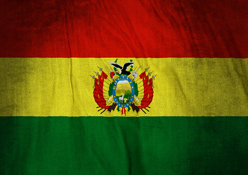 Flag of Bolivia on a crumpled canvas background