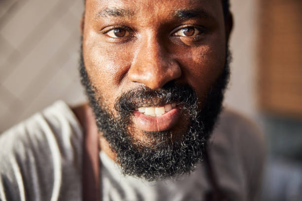 istock Smiling young bearded man cooking in cafe 1278994683