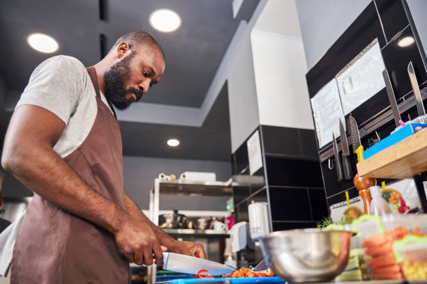 istock Young Afro American chef cooking in professional kitchen 1278994742
