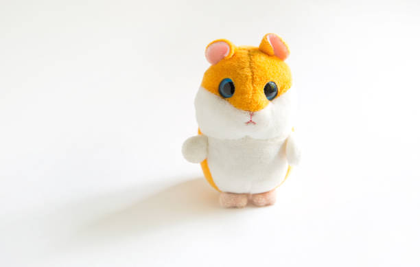 istock Soft plush toy hamster with orange head and white belly on a gray background. 1278995658