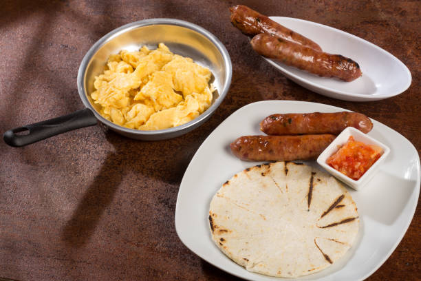 istock Tasty Colombian breakfast; White corn arepa with chorizo and scrambled eggs. 1278997449