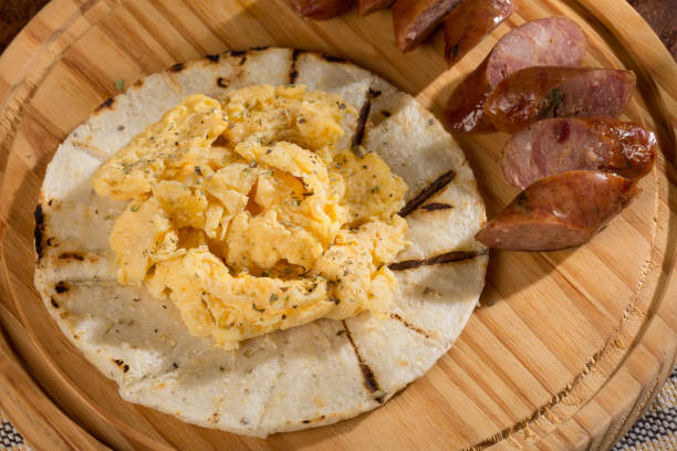 istock Tasty Colombian breakfast; White corn arepa with chorizo and scrambled eggs. 1278997607