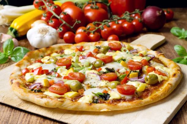 istock Fresh homemade pizza with vegetables, mozzarella and basil 1278998387