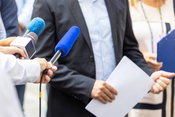 Whistleblower is giving a speech at news conference or media event Whistleblower is giving a speech at press conference or media event whistleblower human role stock pictures, royalty-free photos & images