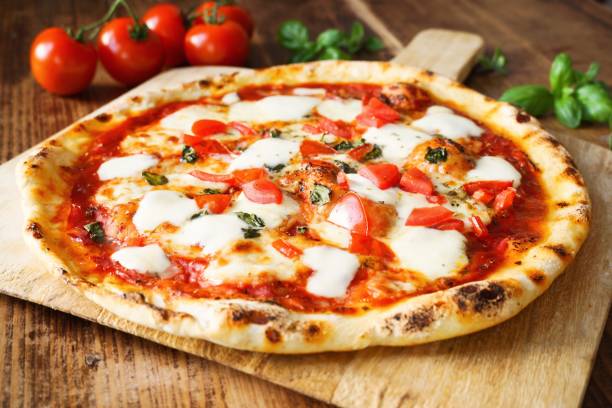 Fresh Homemade Pizza Margherita Fresh Homemade Pizza Margherita with buffalo mozzarella and basil pizza stock pictures, royalty-free photos & images