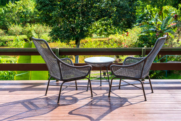 istock Two chairs and table on the backyard in tropical garden with beautiful view 1279001350