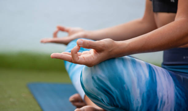 istock Young woman practicing yoga and meditating 1279001675