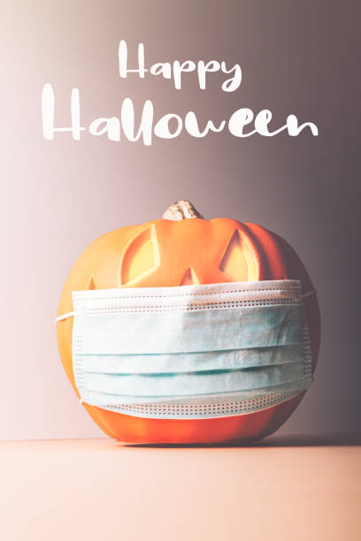 istock Halloween Jack o Lantern in medical mask 1279002699