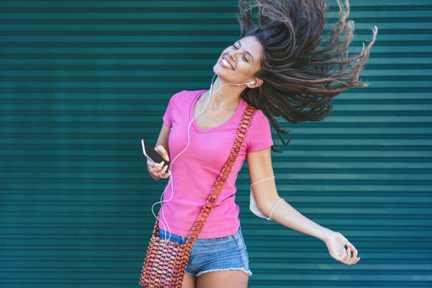 istock Woman dancing to the music 1279002728
