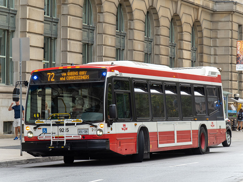 Toronto, Canada; A Toronto Transit Commission TTC Novabus diesel bus on Front Street in downtown Toronto.