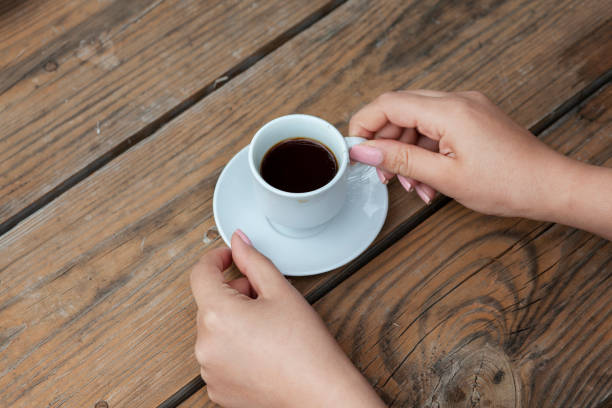 istock woman hand coffee 1279003326