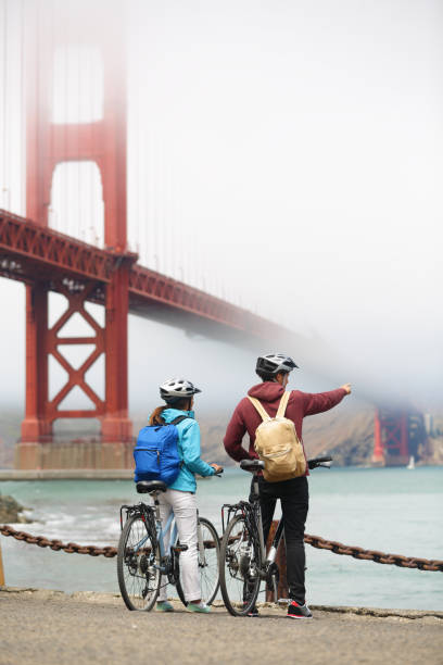 istock Golden gate bridge - biking couple sightseeing 1279003925