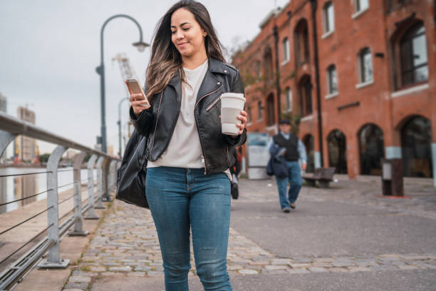 istock Young woman using her phone. 1279004187