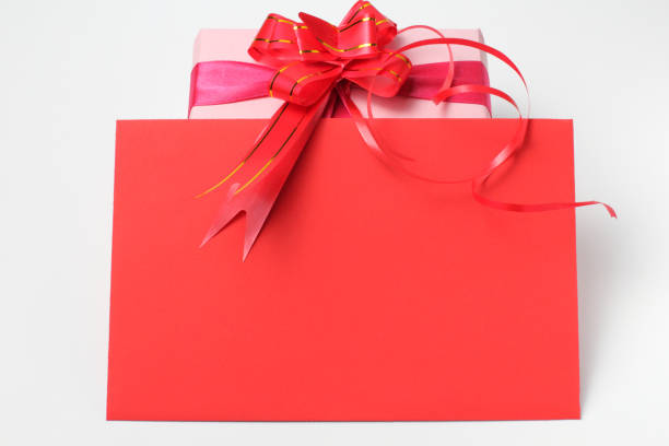 istock Red envelope and gift in packing on a white background, concept of Christmas greetings. 1279009949