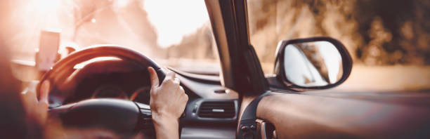 istock Driver driving a car on asphalt road in summer day 1279012308