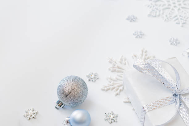 istock Frame with christmas baubles decoration and gift box on a white background 1279012797