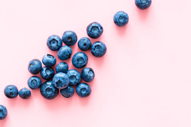 istock Colorful fruit pattern of blueberries on pink background. Top view. Flat lay 1279013842