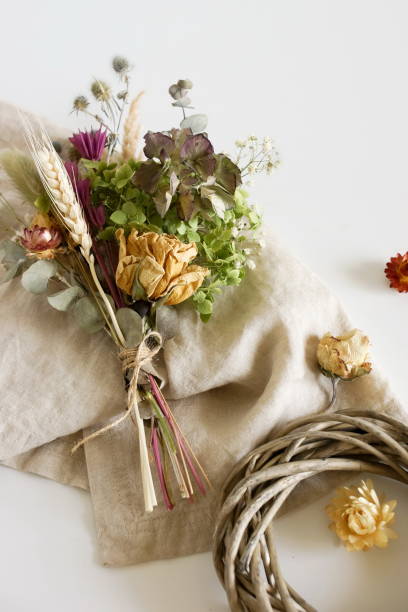 istock Dried flowers and herbs bouquets for making decoration flat lay on white background. Framing dried plants. Top view. Hobby handmade with flowers. 1279019070