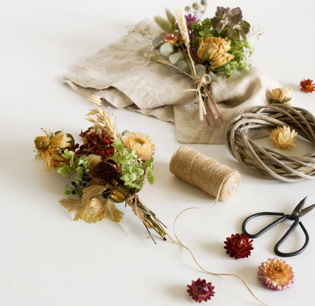 istock Dried flowers and herbs bouquets for making decoration flat lay on white background. Framing dried plants. Top view. Hobby handmade with flowers. 1279019251