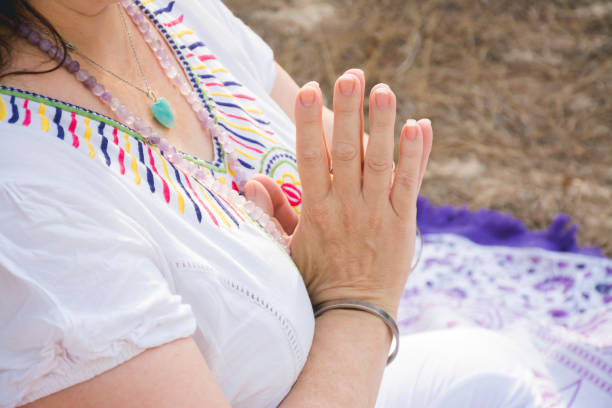 istock Hands of woman meditating 1279019255