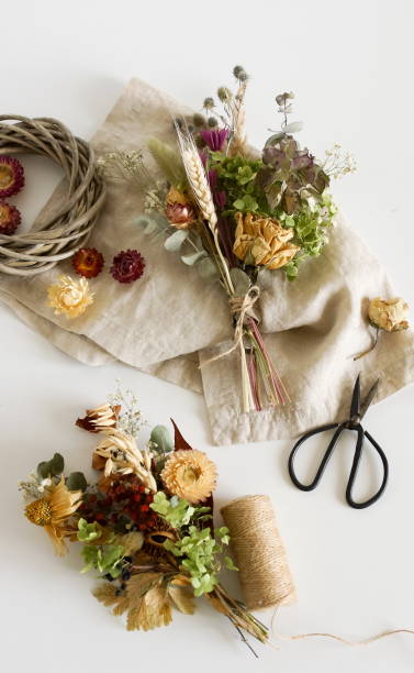 istock Dried flowers and herbs bouquets for making decoration flat lay on white background. Framing dried plants. Top view. Hobby handmade with flowers. 1279019777