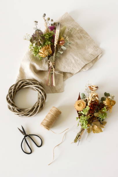 istock Dried flowers and herbs bouquets for making decoration flat lay on white background. Framing dried plants. Top view. Hobby handmade with flowers. 1279020141