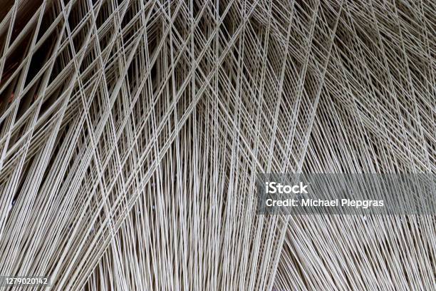 Close Up Texture Of A Lot Of Threads In A Weaving Machine Called A Loom Stock Photo - Download Image Now