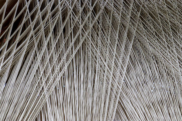close up texture of a lot of threads in a weaving machine called a loom - weave imagens e fotografias de stock