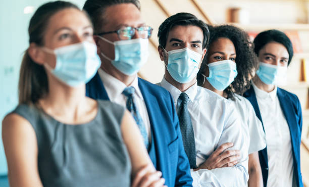 istock Business team with face protective mask 1279021559