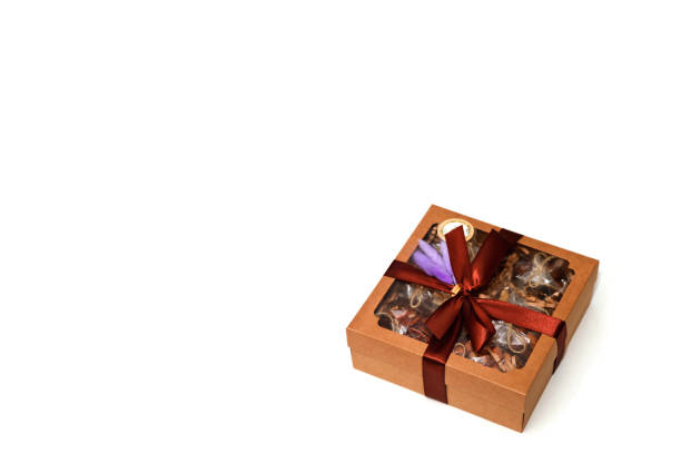 istock Gift box with nuts on white insulating background for holiday 1279023083