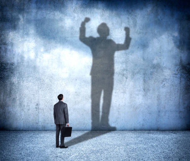 istock Shadow Of Man Aspiring To Confidence 1279024618