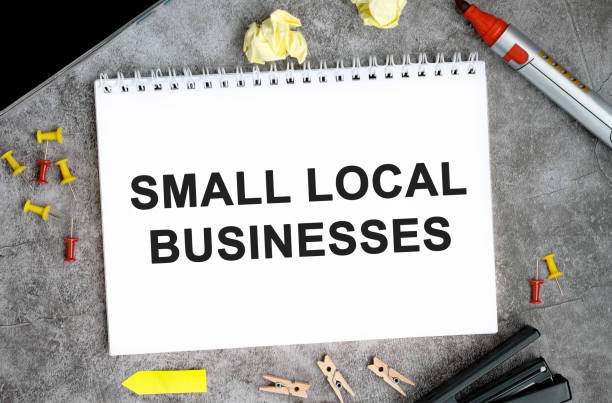 istock Small local businesses text on a white notebook with pins, marker and stapler on a concrete table 1279025138