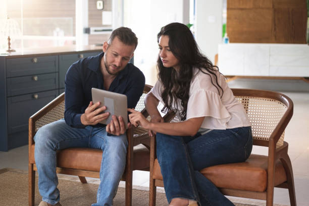 istock Man and woman sitting at chairs. 1279026564