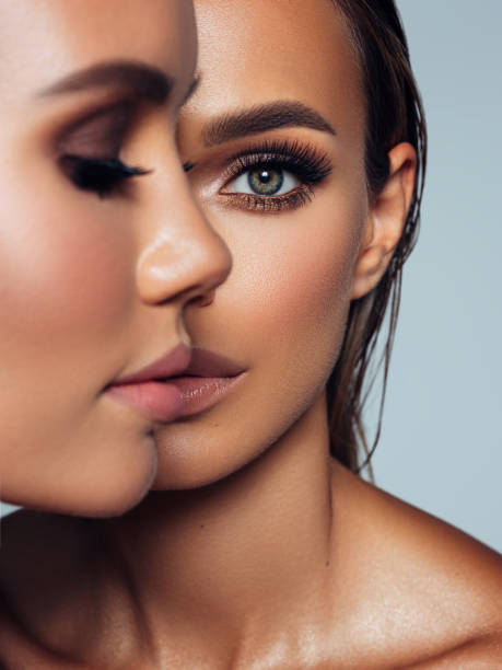 close-up portrait of two beautiful girls - human eye eyebrow eyelash beauty imagens e fotografias de stock