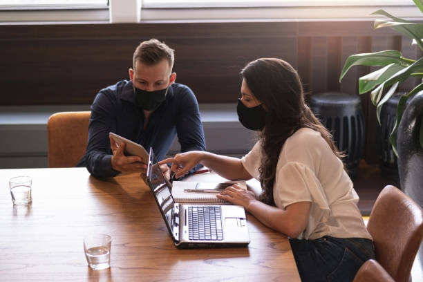 istock Man and woman in a office. 1279028926