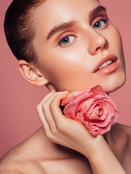 istock Beautiful woman with rose 1279029311