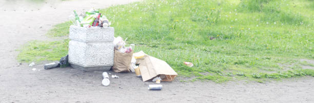 istock Overflowing trash can and lying next to the garbage from fast food in the park. 1279031849