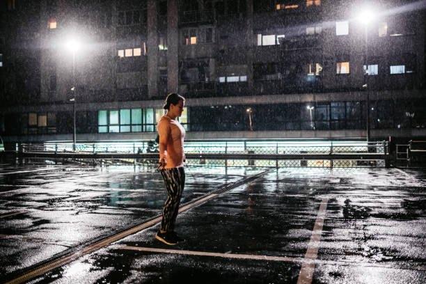 istock Woman skipping rope in the rain 1279034241