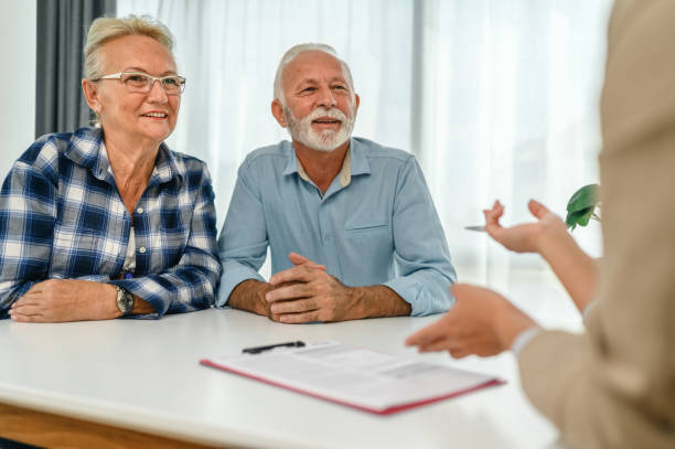 istock Senior couple with financial advisor 1279035513